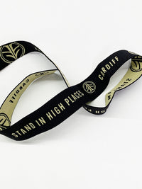 1 1/4" Black/Tan Branded Text Medallion Jacquard Elastic - Corbeaux Clothing - BY THE 5 YARD PIECE