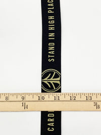 1 1/4" Black/Tan Branded Text Medallion Jacquard Elastic - Corbeaux Clothing - BY THE 5 YARD PIECE