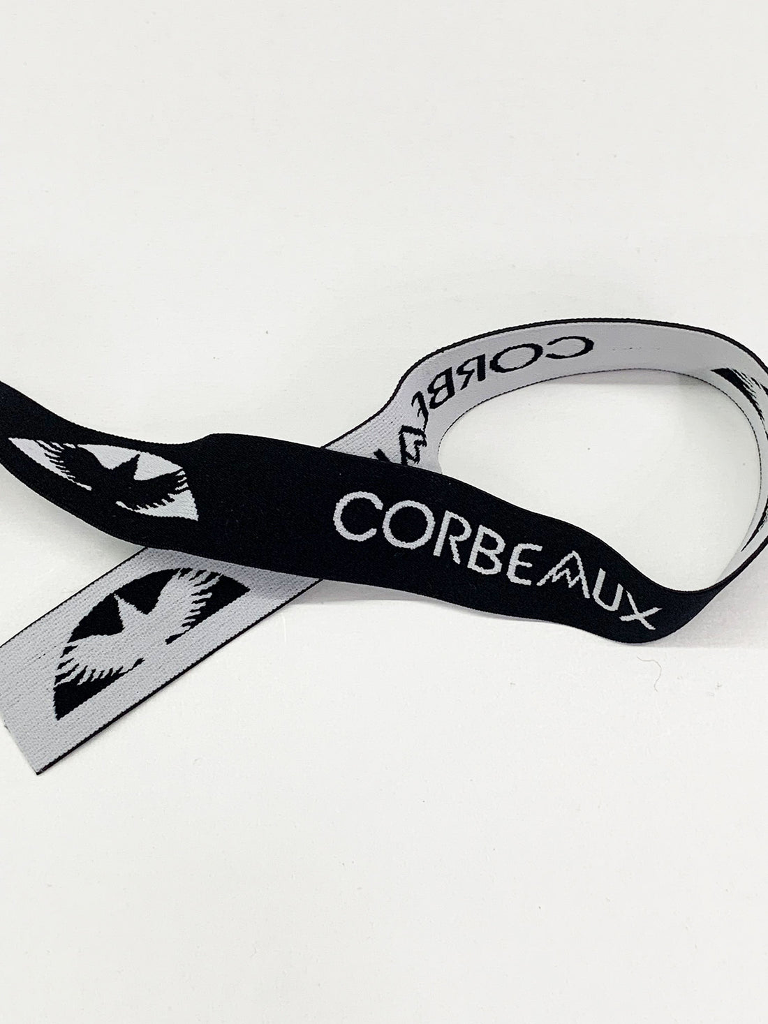 1 1/4" Black/Bright Silver Branded Text Medallion Jacquard Elastic - Corbeaux Clothing - BY THE 5 YARD PIECE