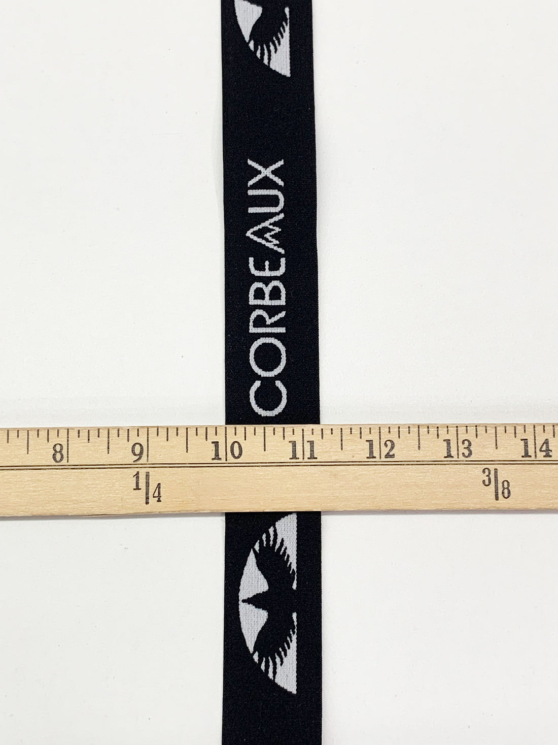 1 1/4" Black/Bright Silver Branded Text Medallion Jacquard Elastic - Corbeaux Clothing - BY THE 5 YARD PIECE