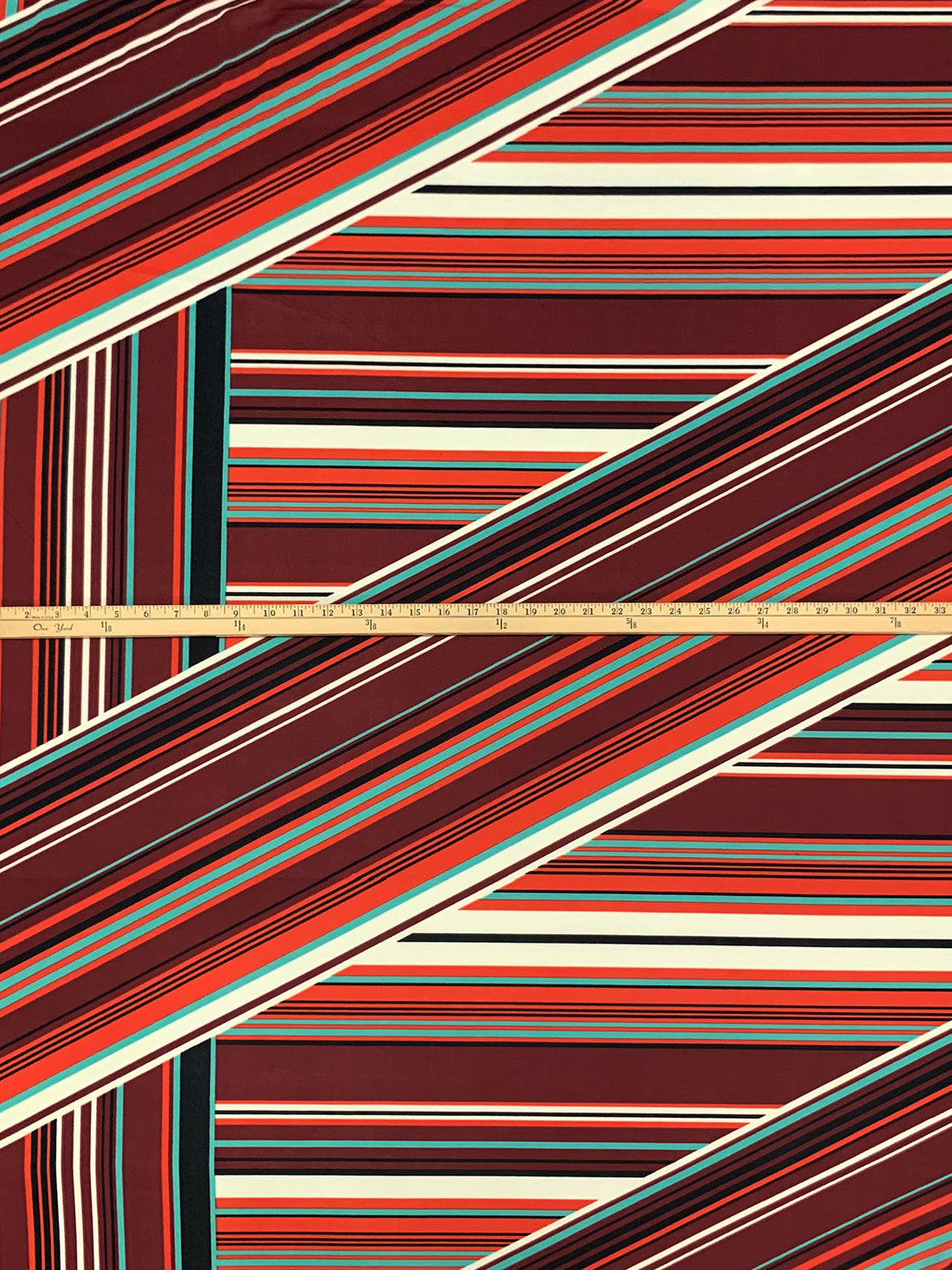 Muted Garnet/Medium Vermilion/Black/Multi 100% Polyester Large Overlapping Stripe Print Crepe Double Knit 56W