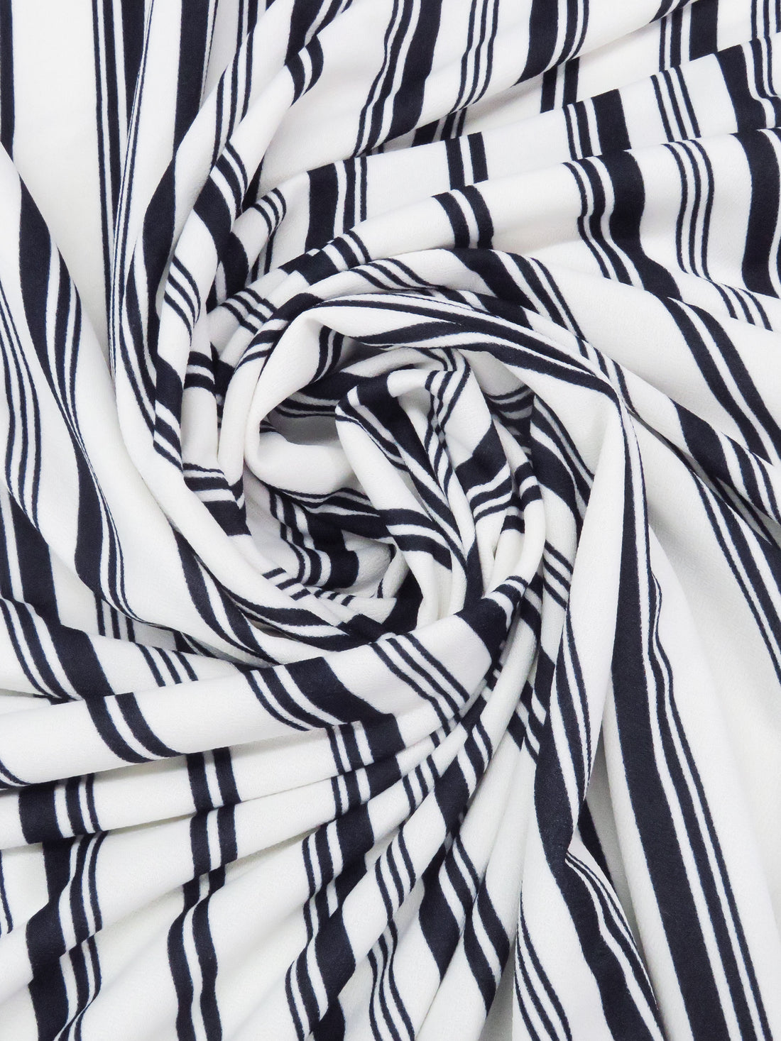 White/Muted Midnight Navy Polyester/Lycra Vertical Multi Stripe Print Crepe Double Knit 56W