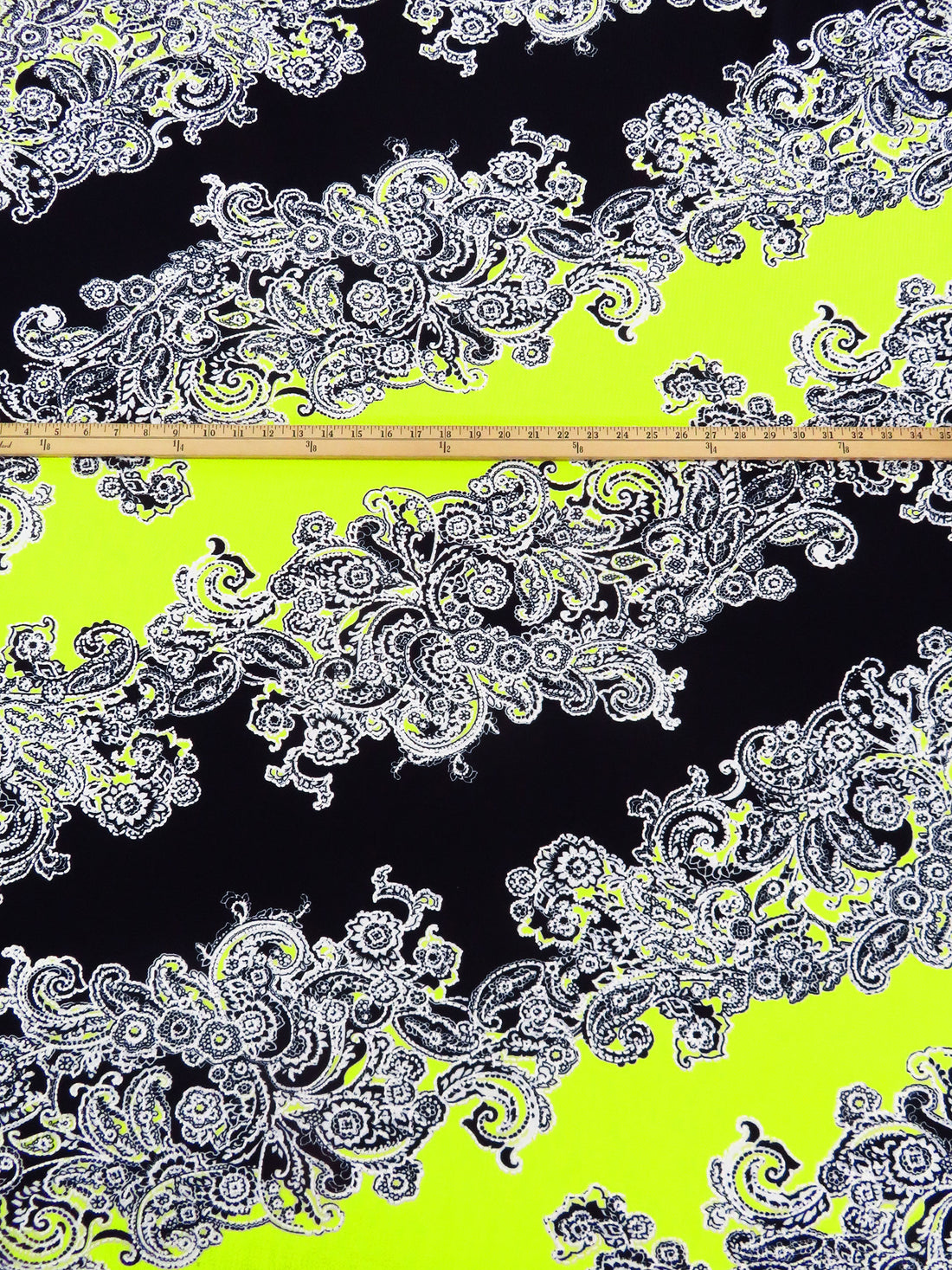 Black/White/Bitter Lemon Polyester/Lycra Diagonal Floral Paisley Puff Print Liverpool Double Knit 56W