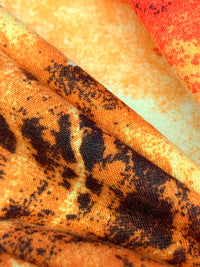 Tangerine/Soft Yellow/Black Polyester/Rayon/Lycra Abstract Bursts Print French Terry Knit 56W