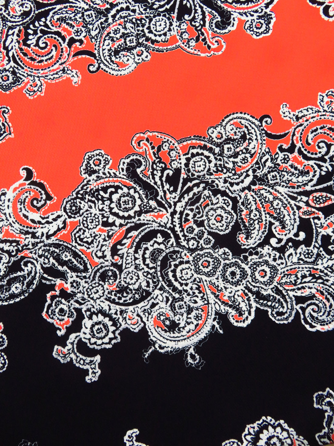 Black/White/Poppy Polyester/Lycra Diagonal Floral Paisley Puff Print Liverpool Double Knit 56W