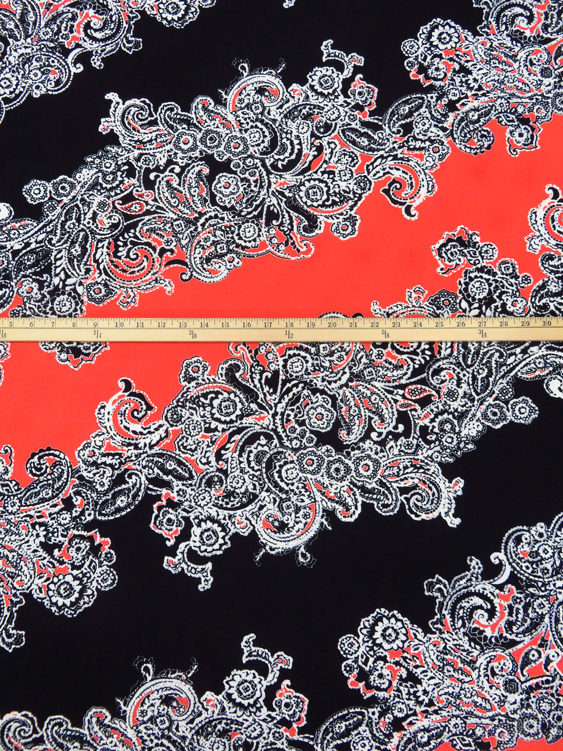 Black/White/Poppy Polyester/Lycra Diagonal Floral Paisley Puff Print Liverpool Double Knit 56W