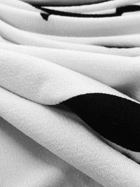 Snow White/Pitch Black Polyester/Lycra Silhouette Floral Print ITY Knit 60W