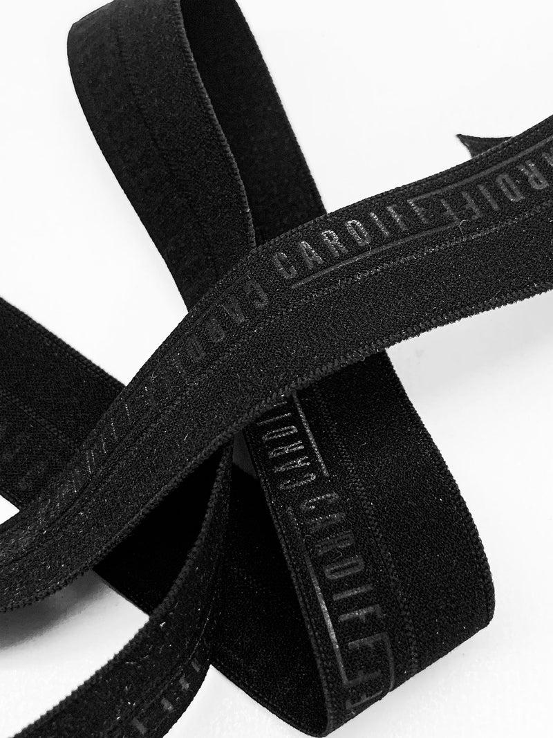 SOLD BY THE SPOOL - 3/4" Black Branded Text Fold-Over Elastic - Corbeaux Clothing