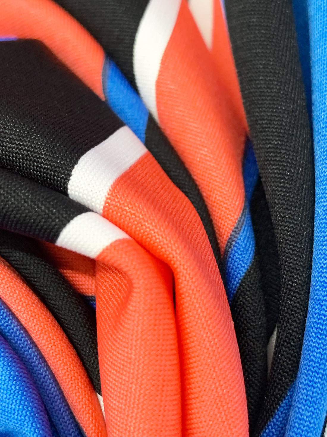 Fiesta Orange/Vivid Blue/Black/White Polyester/Lycra Large Vertical Stripe Print DTY Knit 60W