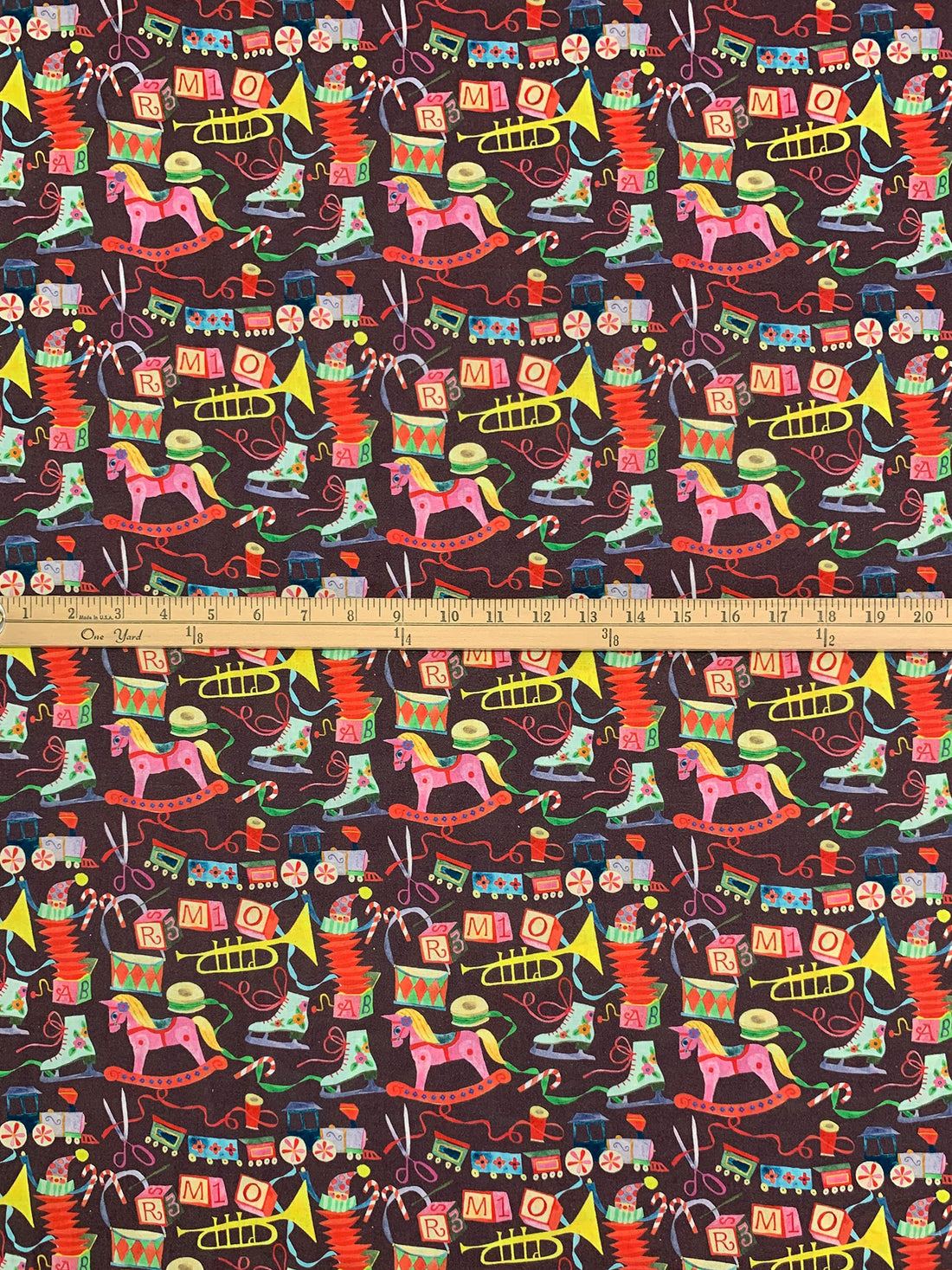 Muted Baked Plum Brown/Dandelion/Vermilion/Multi 100% Cotton Presents & Toys Print Quilt Weight Woven 43W