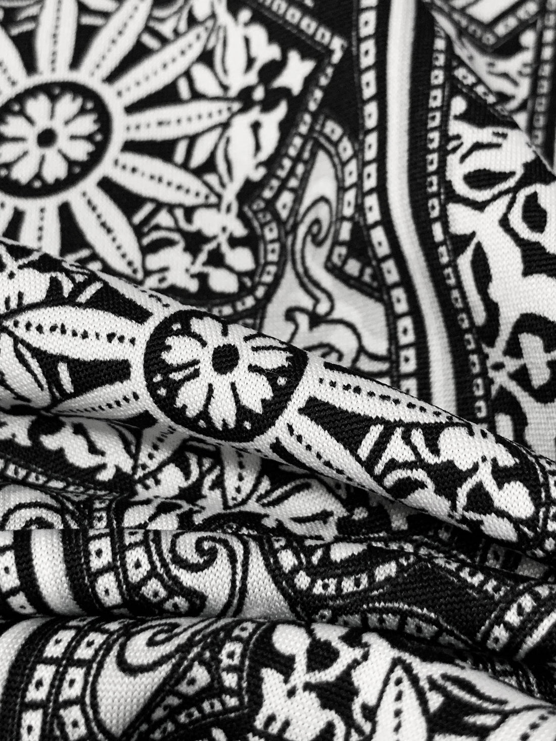 White/Black Polyester/Lycra Stylized Double Border Medallion Print DTY Knit 62W