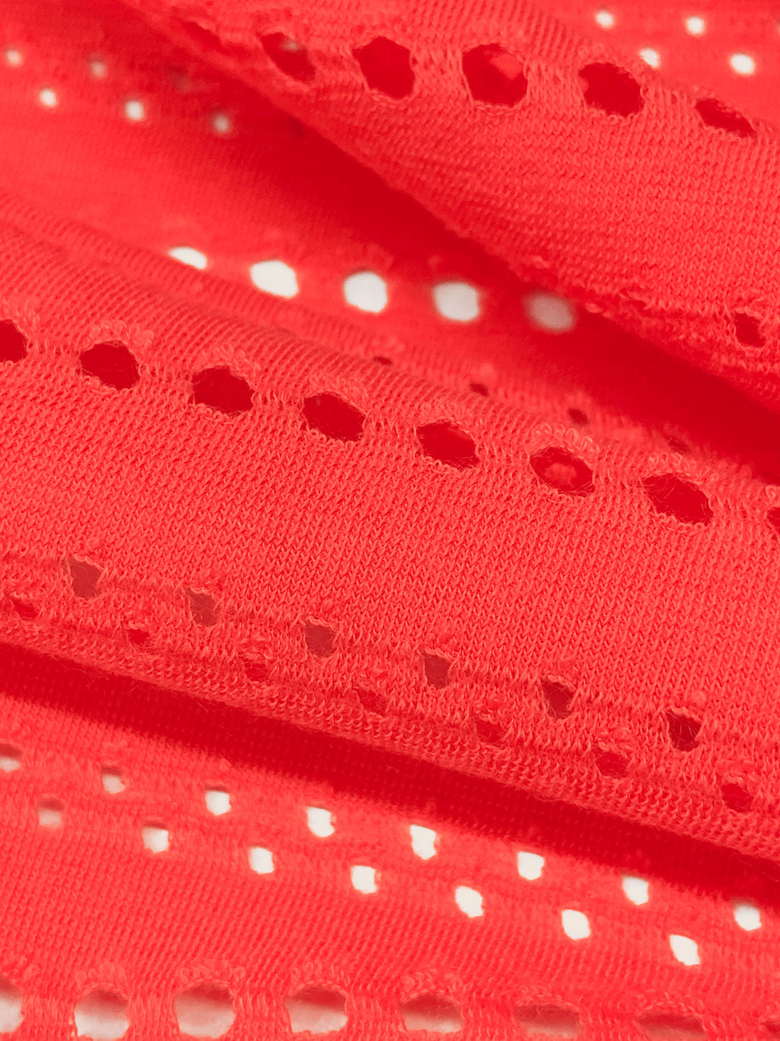 Coral Polyester/Lycra Horizontal Eyelet Knit 55W