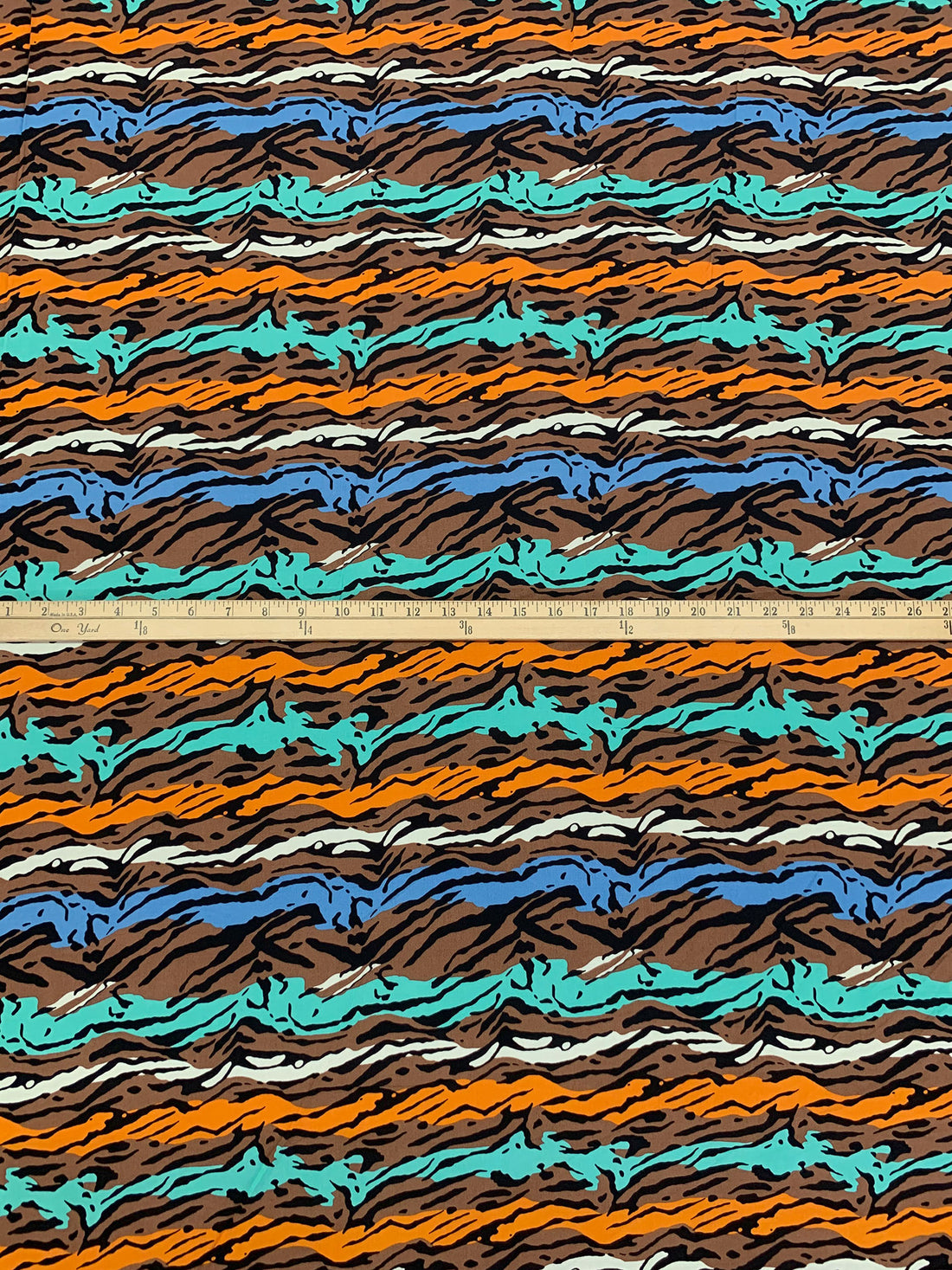 Coyote Brown/Tangerine/Cyan Azure/Multi 100% Rayon Horizontal Stylized Animal Print Challis 57W