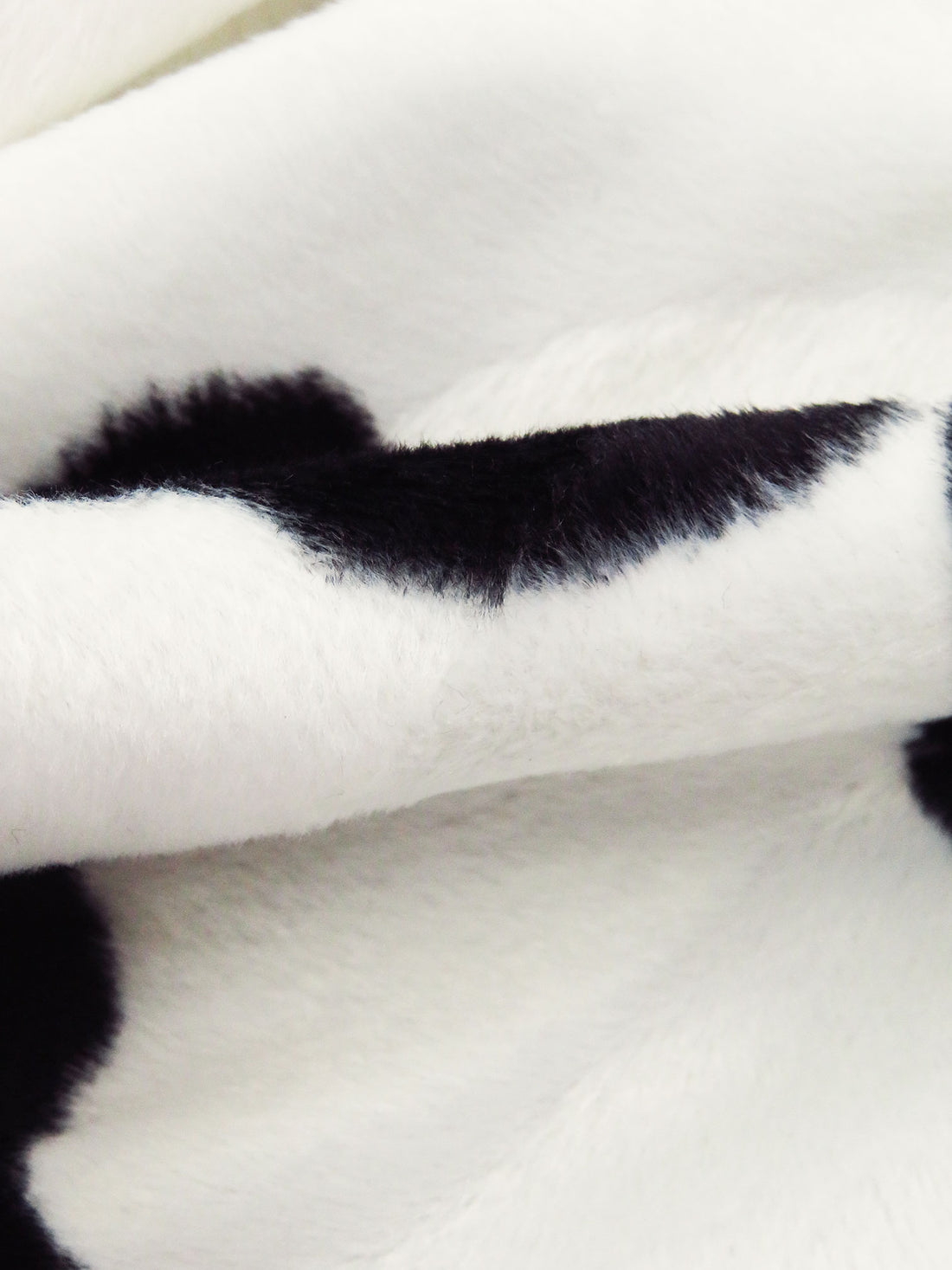 Black/Off-White 100% Polyester Cow Print On Vertical Wave Weave Faux Fur - NY Designer - 60W
